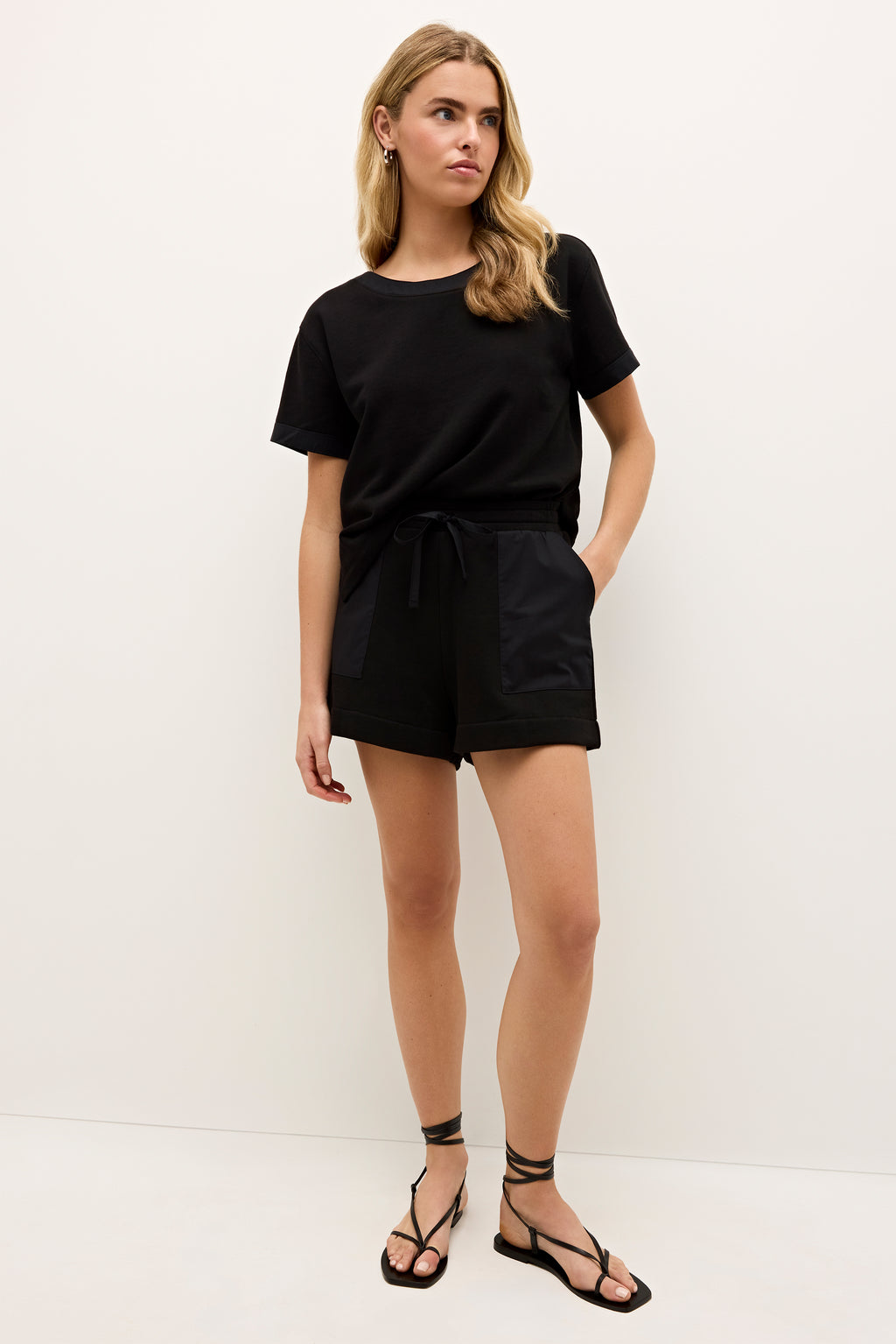 Classic black short sleeve top with a crew neckline and slim silhouette