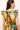 Sleeveless dress featuring a rainbow watercolor print and voluminous ruffle layers