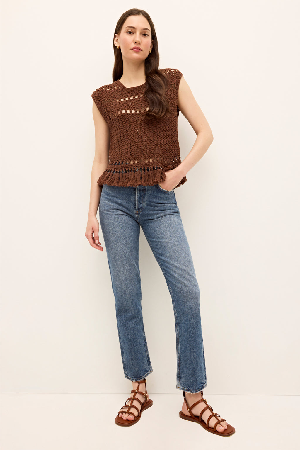 Boho inspired brown crochet top with scalloped edges and tassel trim