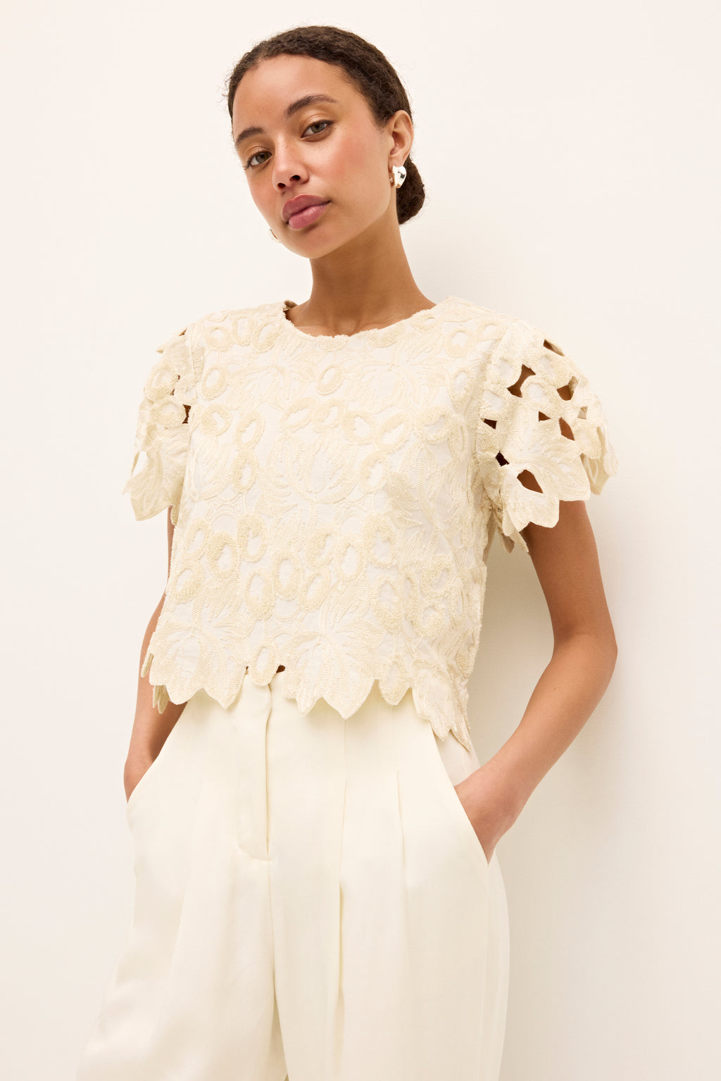 Ivory short sleeve blouse with floral embroidery and scalloped edges