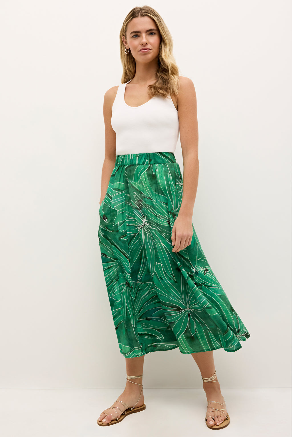 Green midi skit with tropical leaf print and full A-line silhouette