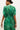 Short sleeve green dress with ruched bodice and graphic botanical pattern