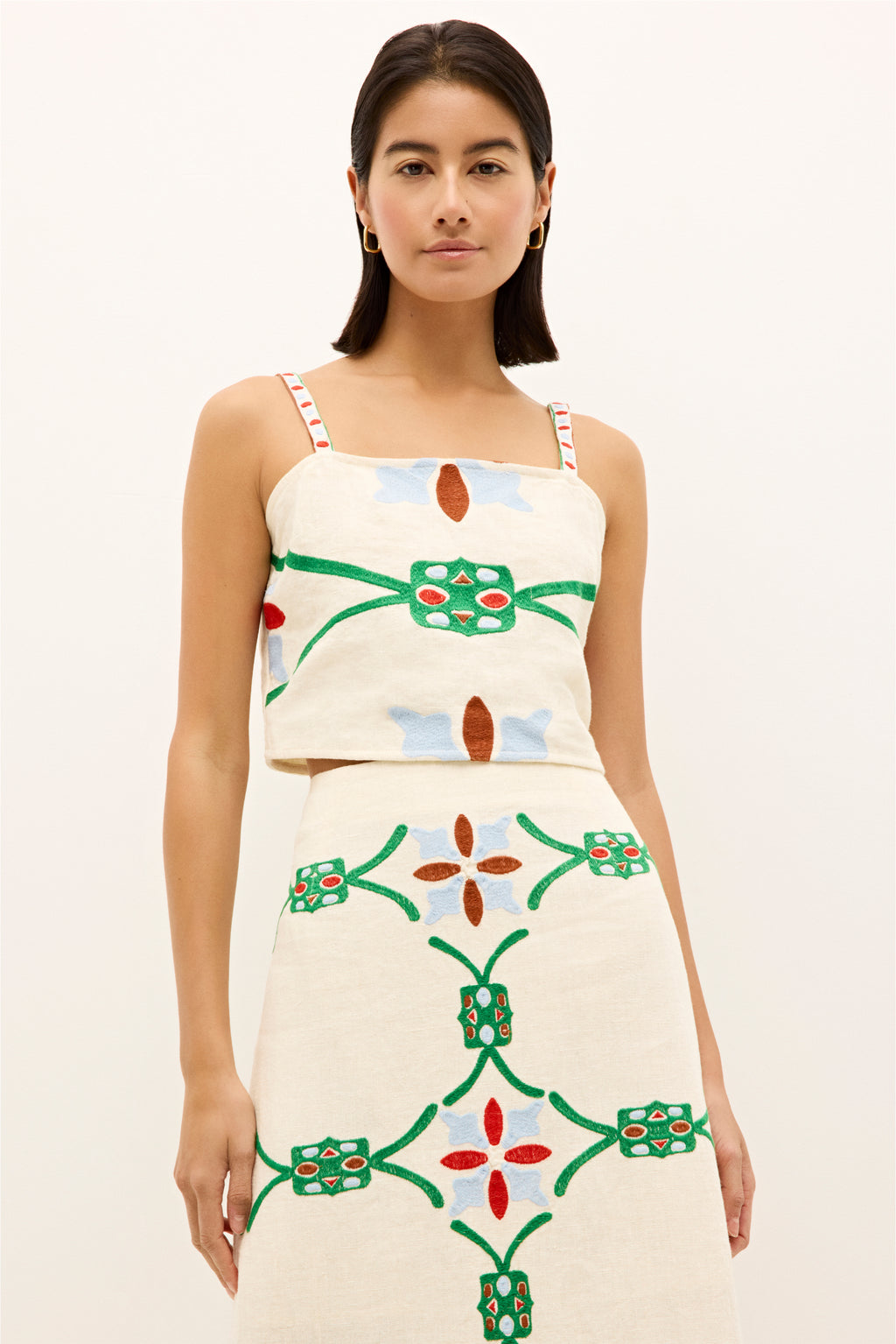 Cream tank top with colorful geometric embroidery