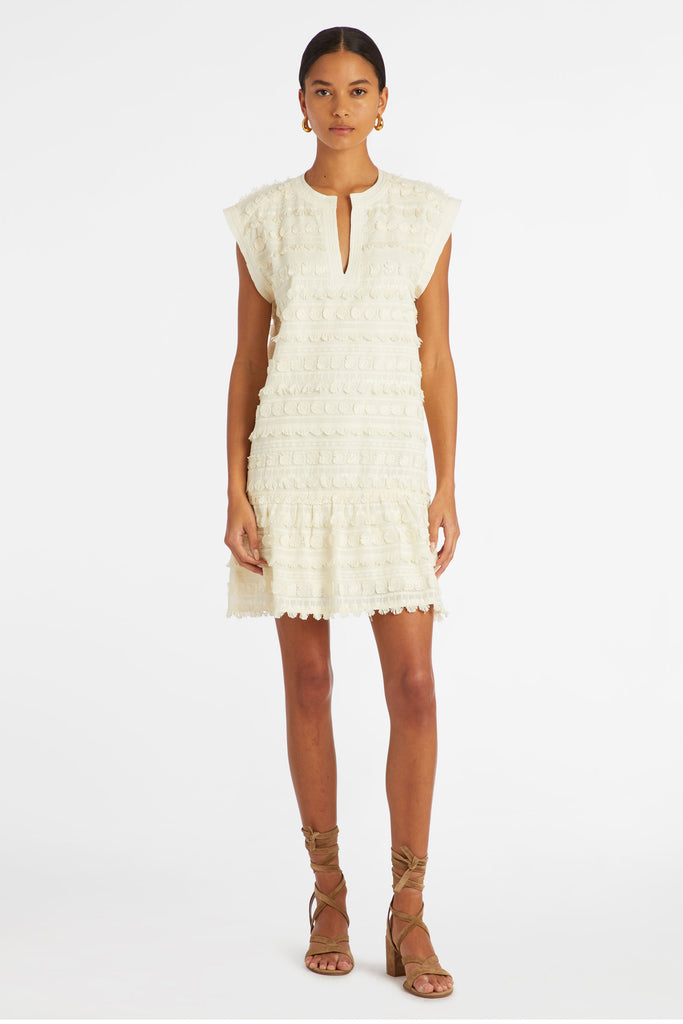 Solid white short dress with short tassels to form the pattern 