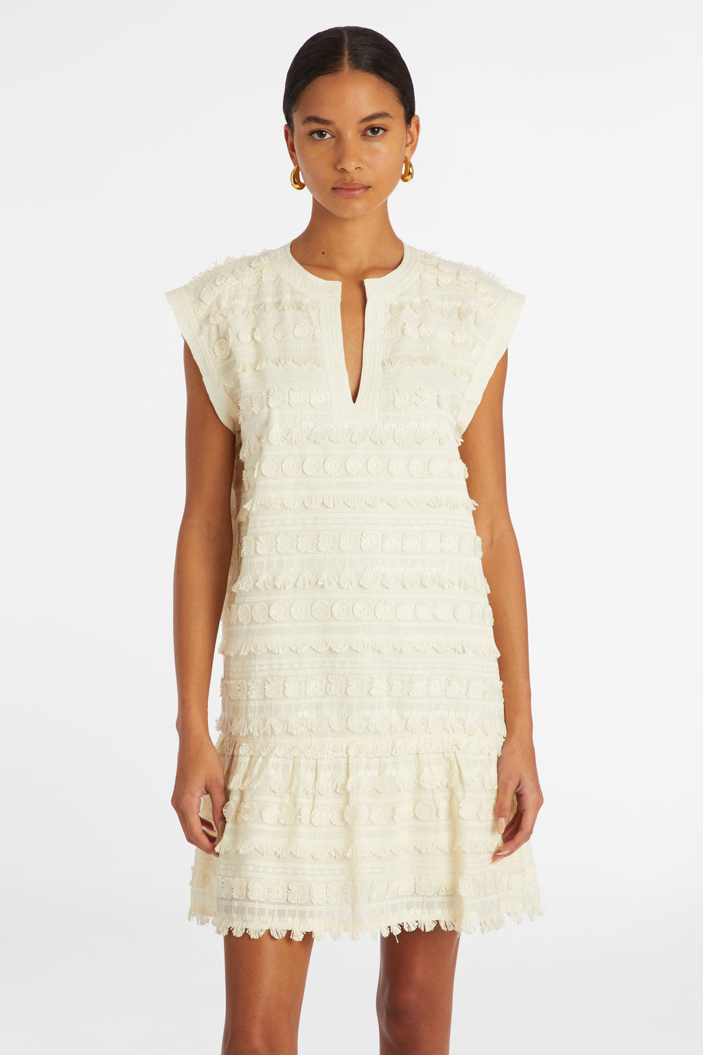 Short white dress in a solid white with short sleeves and a v-neckline