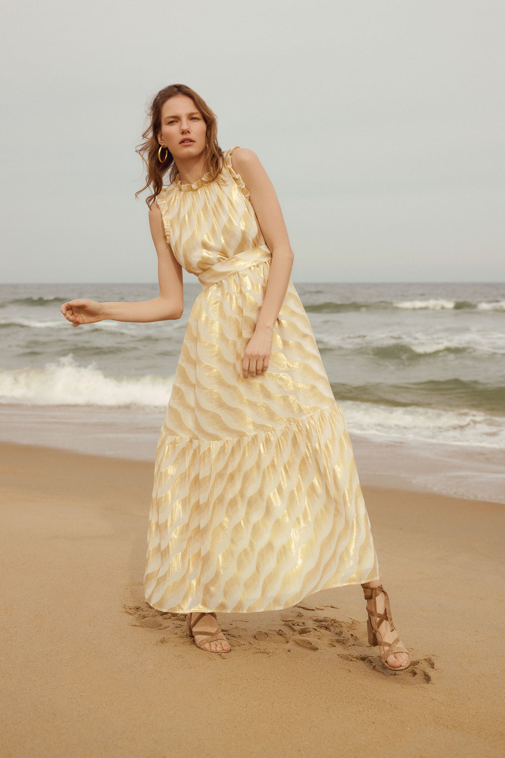Maxi dress with adjustable tied waist belt with a flutter detailed neckline