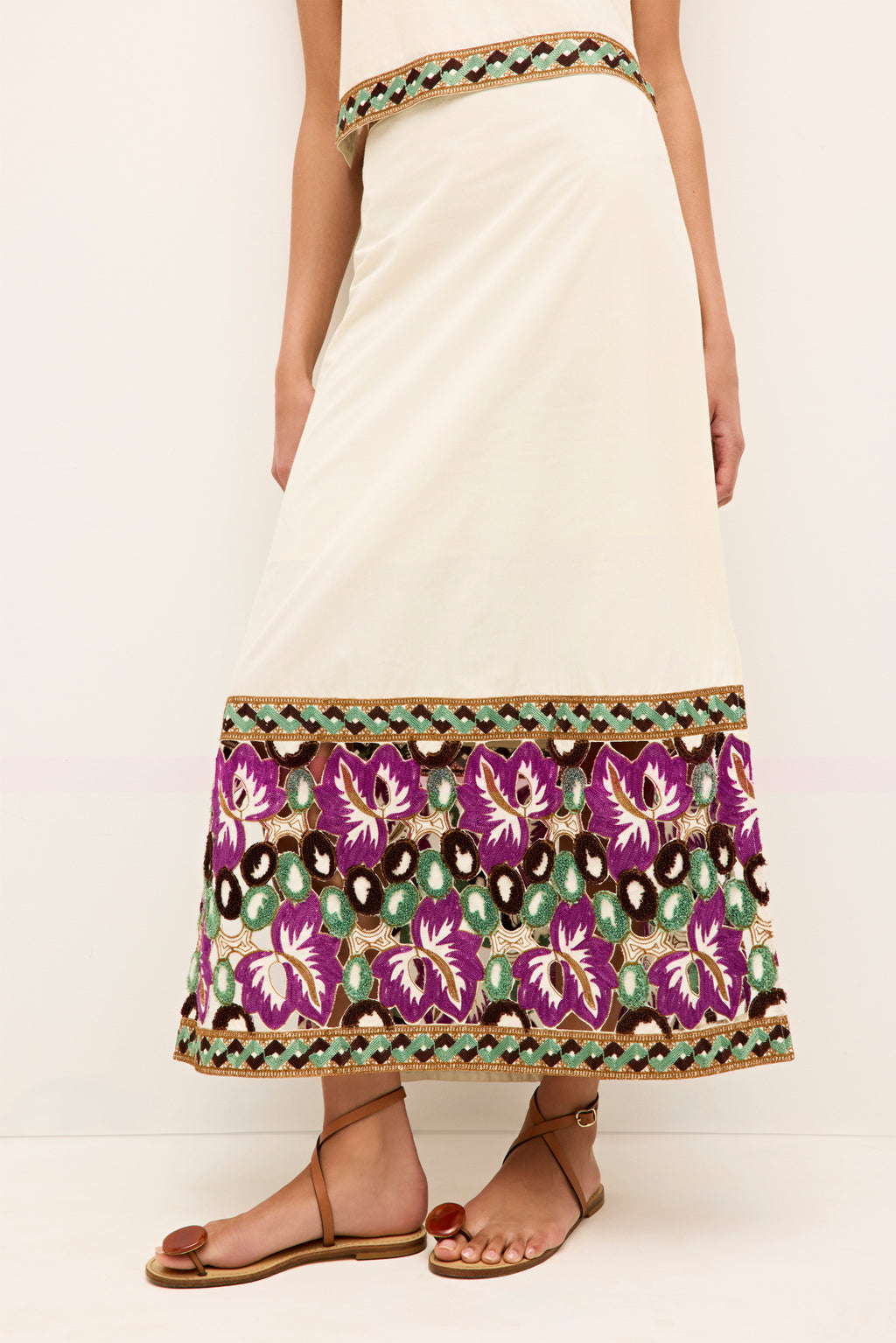 High waisted cream skirt with purple floral and green berry embroidered border 