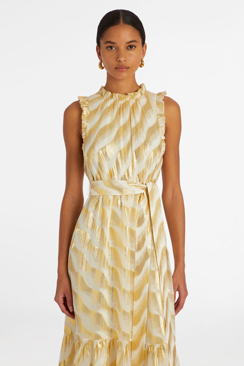 Maxi dress with delicate ruffle detailing at the sleeve and neckline with a sash belt at the waist