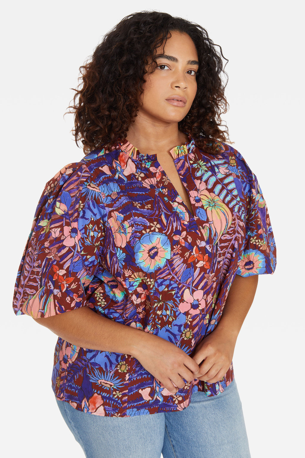 Puff sleeve v-neck top with ruffle details on the neckline in a bold floral print