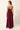 Purple dress with a tiered skirt and pleated bodice