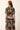 Short sleeve caftan belted midi dress with a black multicolored tropical print