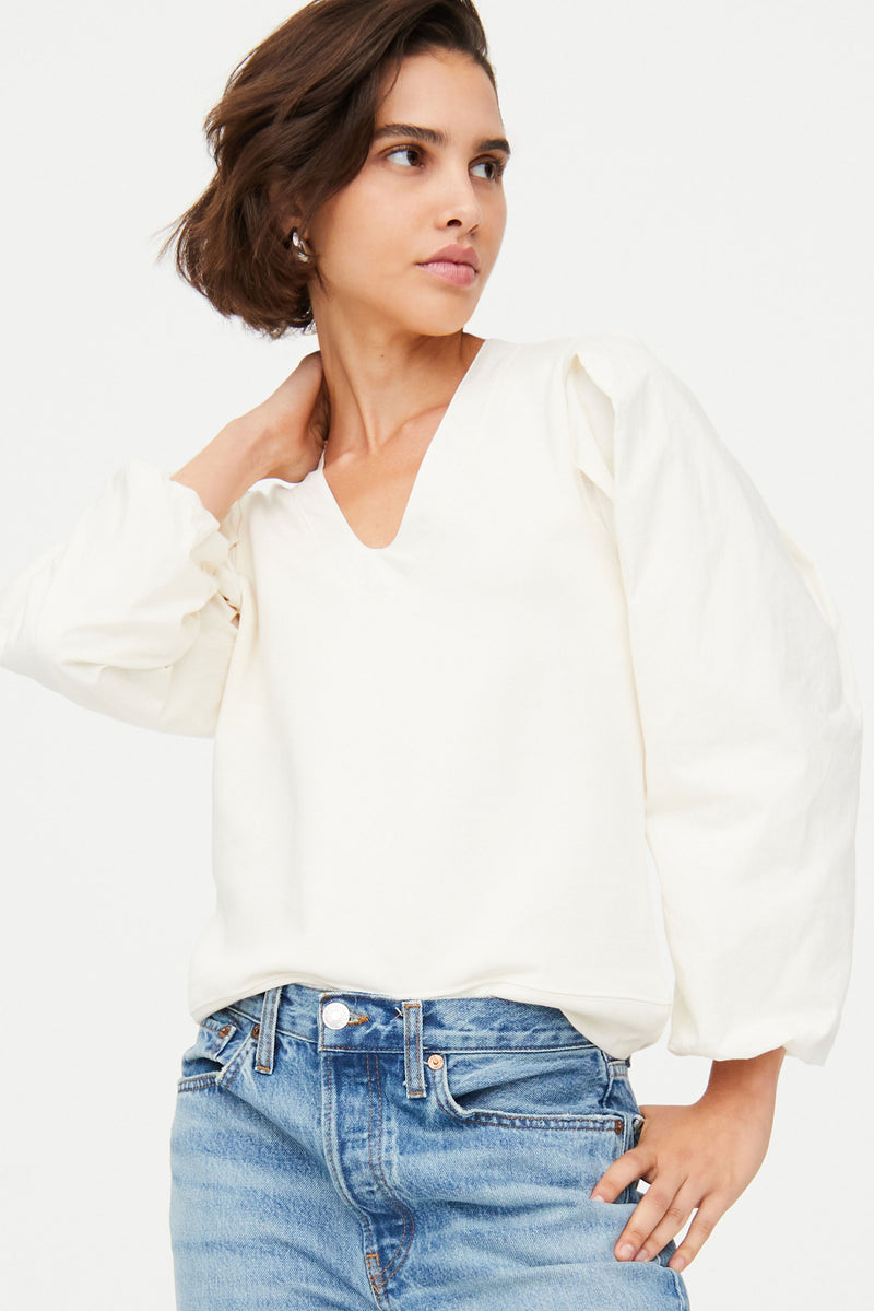 Long sleeve sweatshirt top in a solid cream color