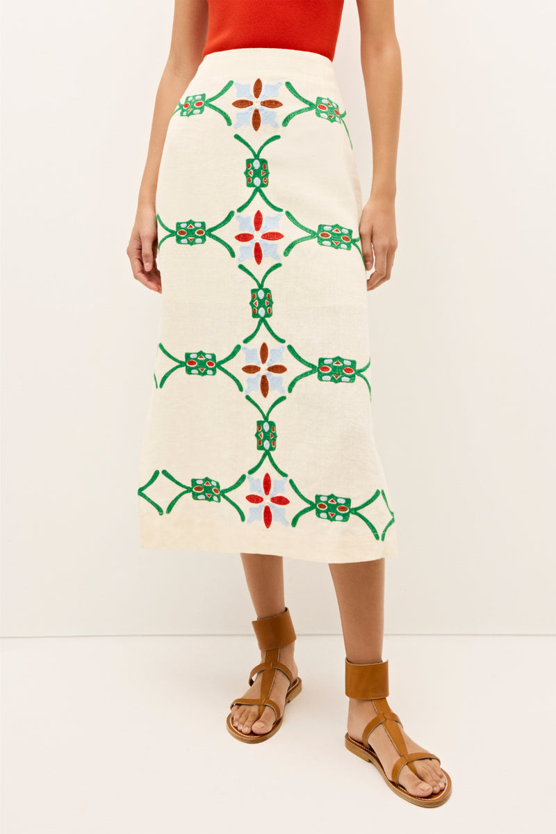 Linen pencil skirt with symmetrical green, red, and blue stitched motifs