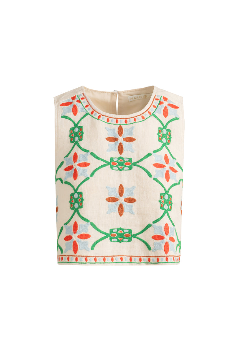 Cream top with vibrant stitched designs and clean lines 