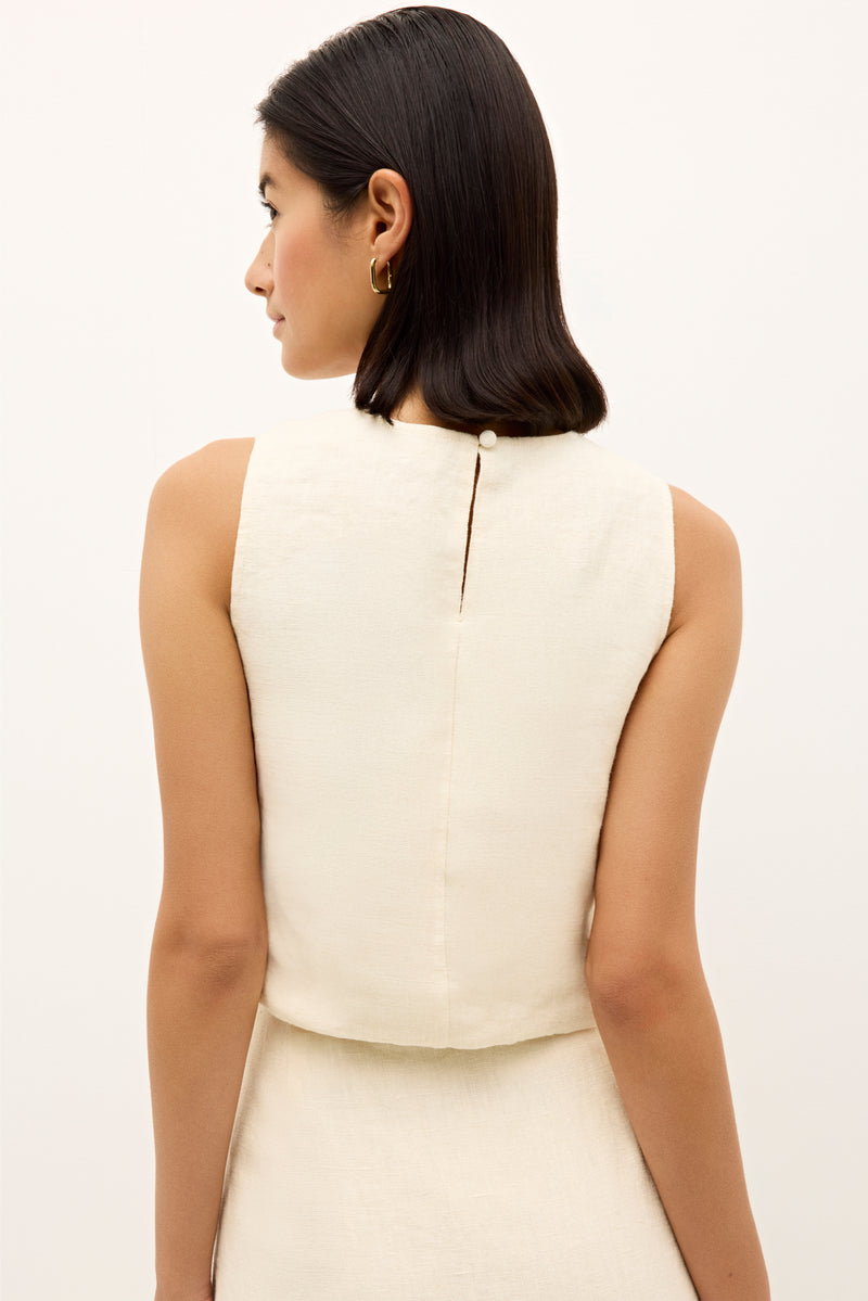 Bohemian inspired embroidered sleeveless top in a natural woven fabric 