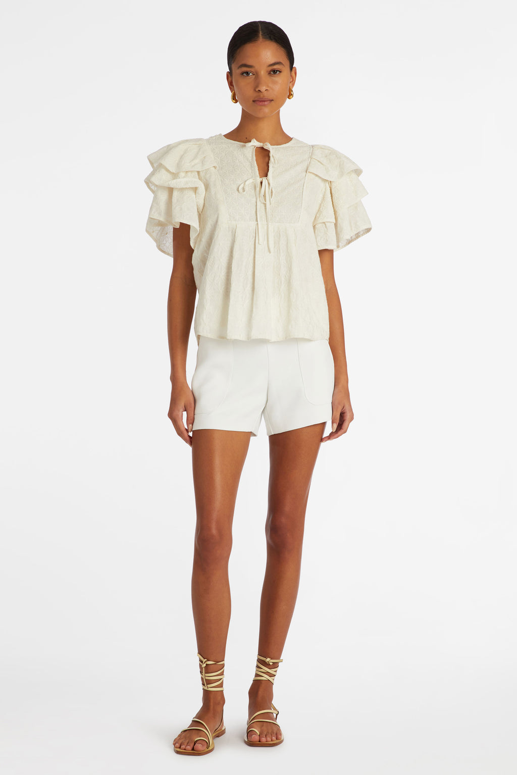 Top with a straight silhouette and tiered ruffle sleeves