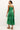 Elegant sleeveless dress in vibrant green with allover tropical motif 
