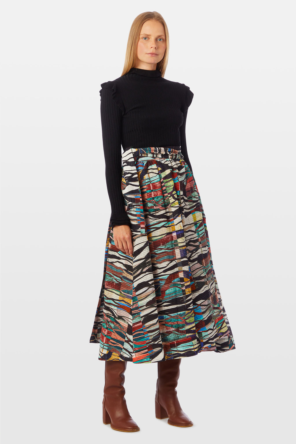 Traditional wrap skirt with long tie belt at the waist in a wavy multi-colored print