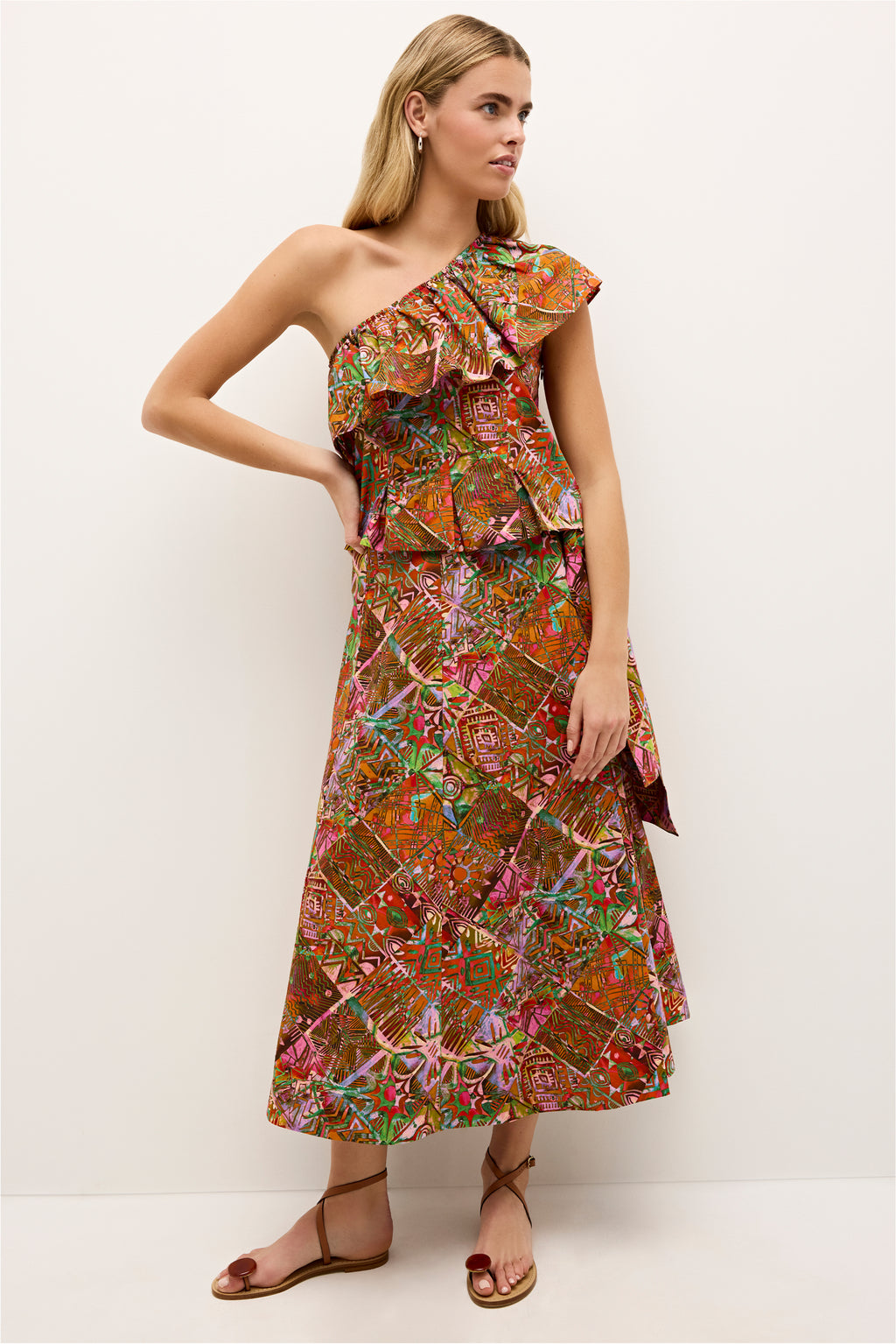 High waisted midi skirt featuring vibrant ethnic motifs and a tie waist 