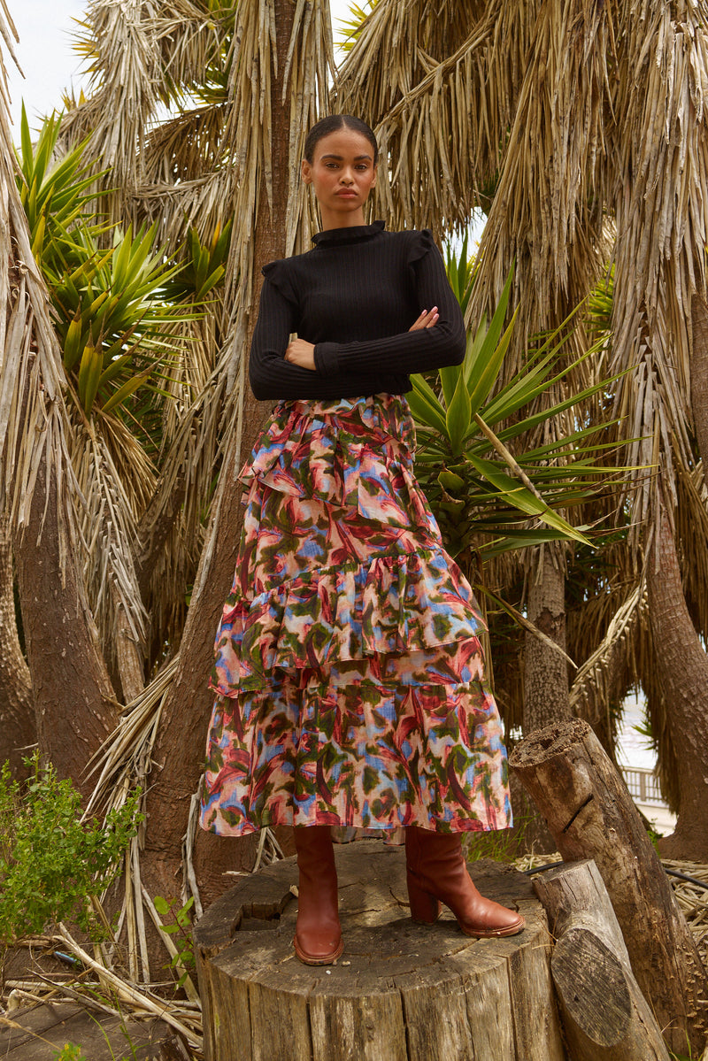 Asymmetrical tiered maxi skirt with a hidden zipper and abstract floral pattern