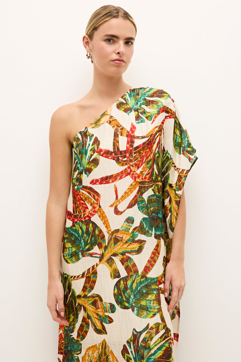 Asymmetrical dress with a belted waist and vibrant botanical pattern 