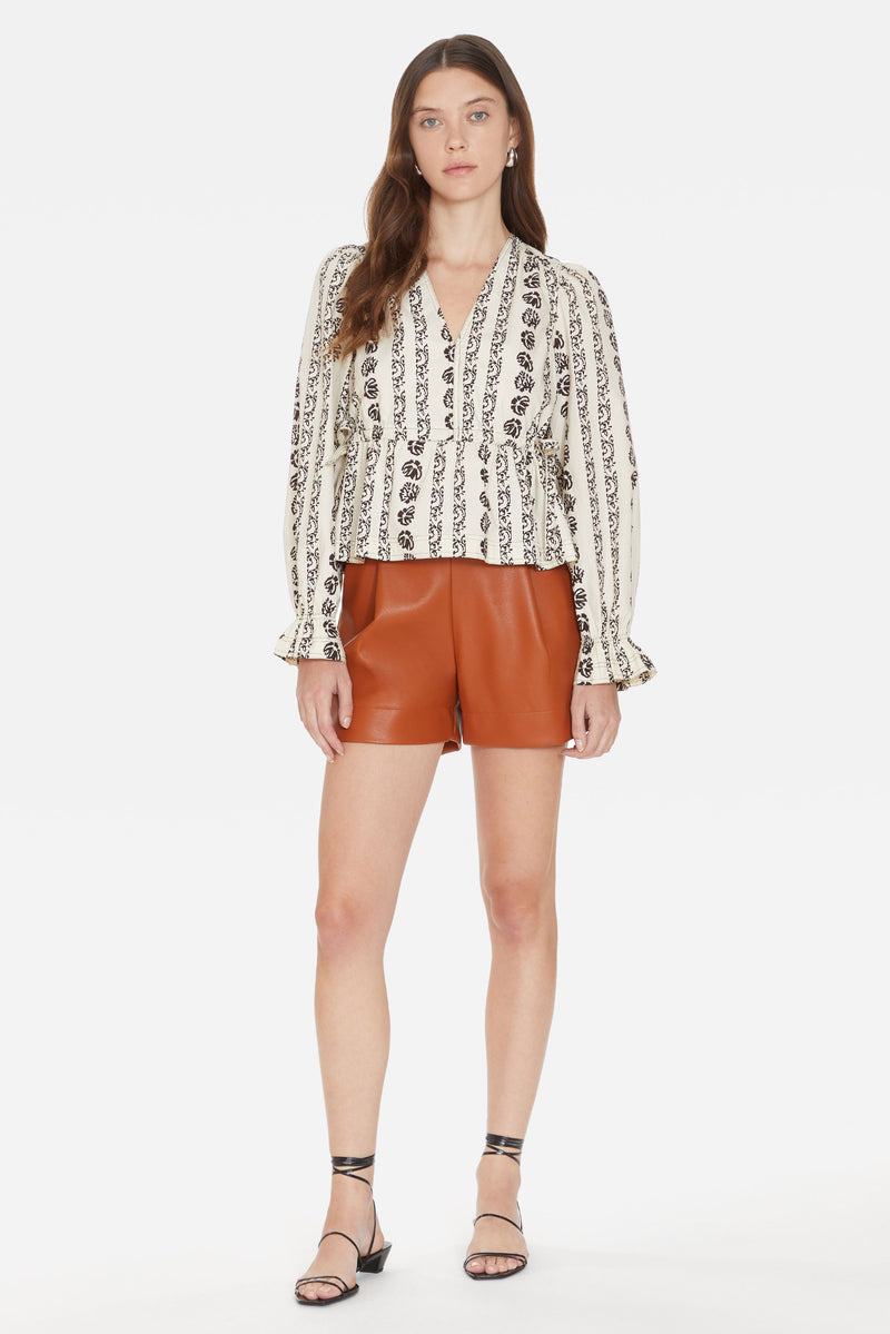 High-waisted shorts with front pleats, side pockets, and back zipper