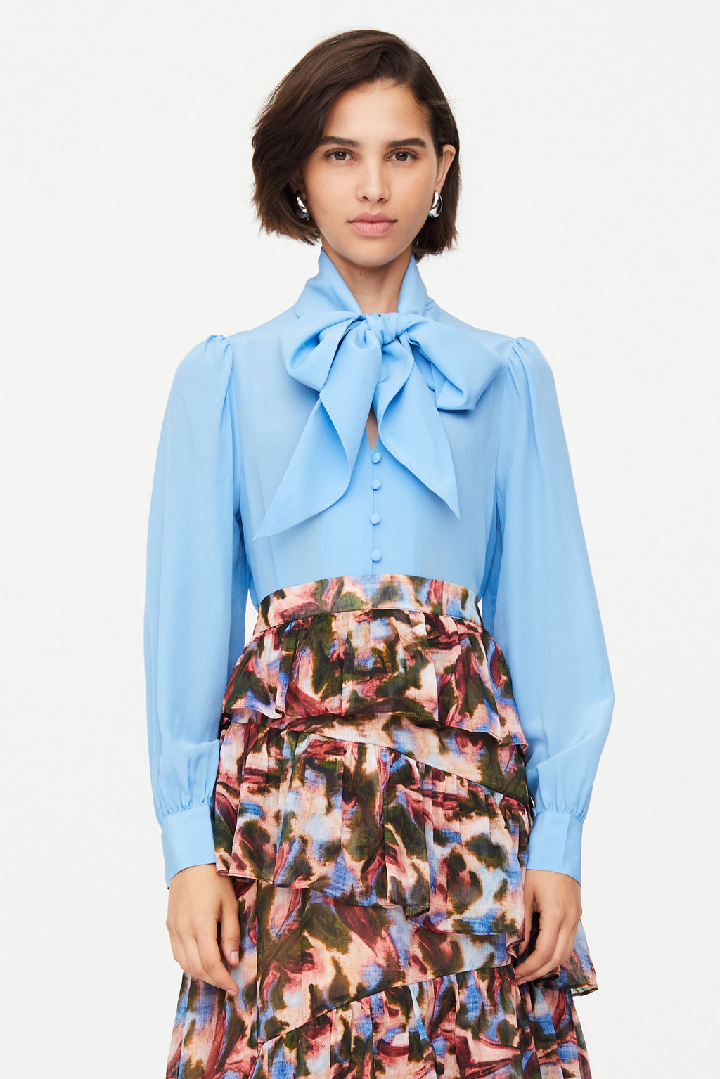 Blue button closure top with oversized bow