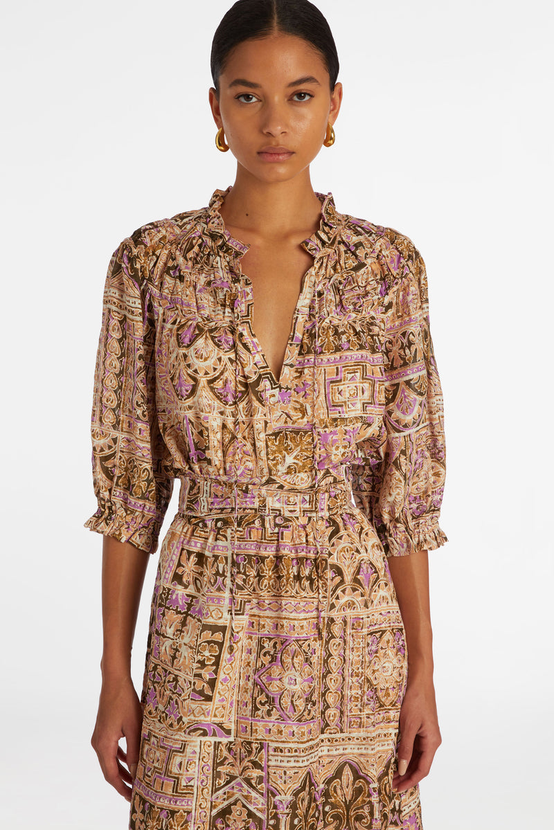 Top with ruffled v-neckline and ruffled sleeves