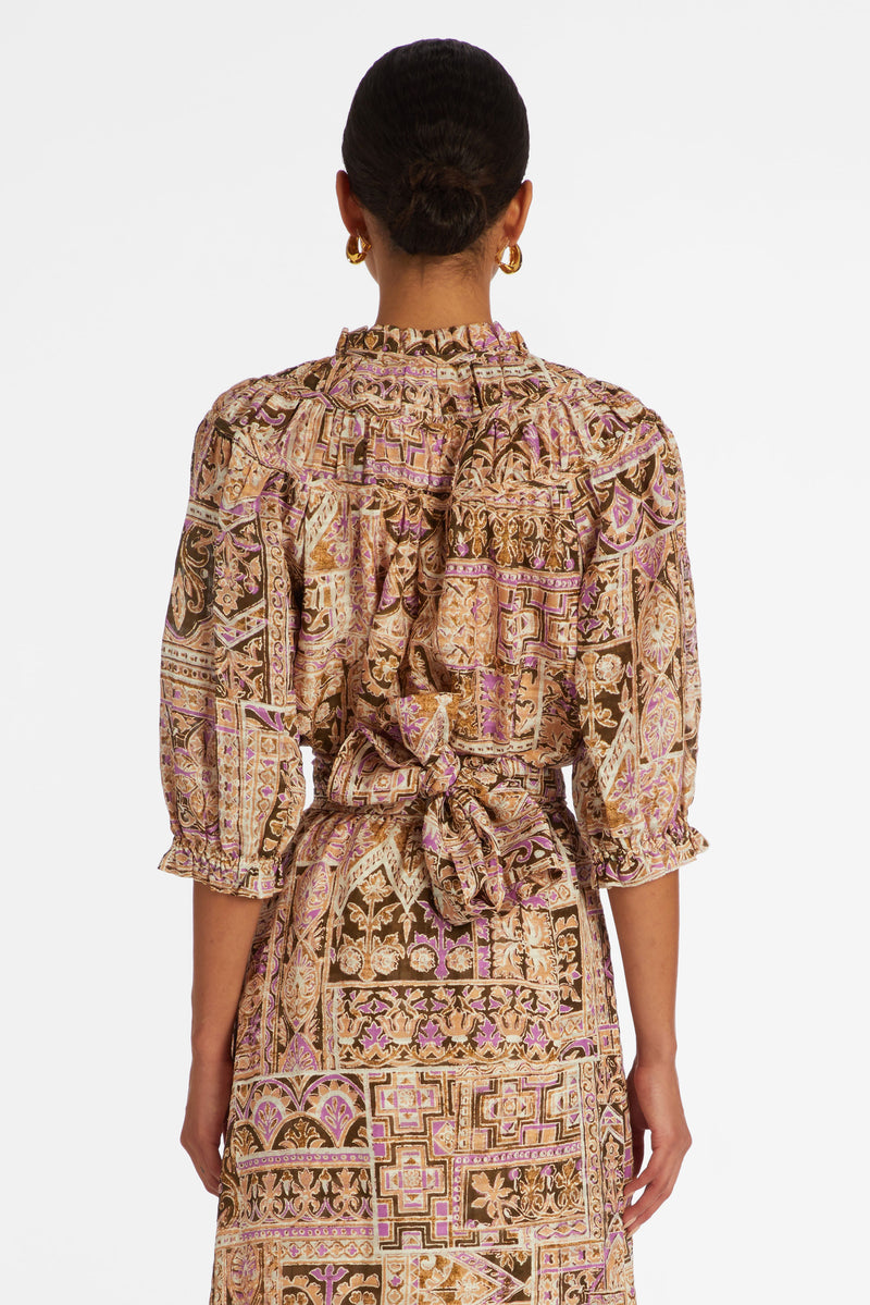 Top with ruffled v-neckline and ruffled sleeves