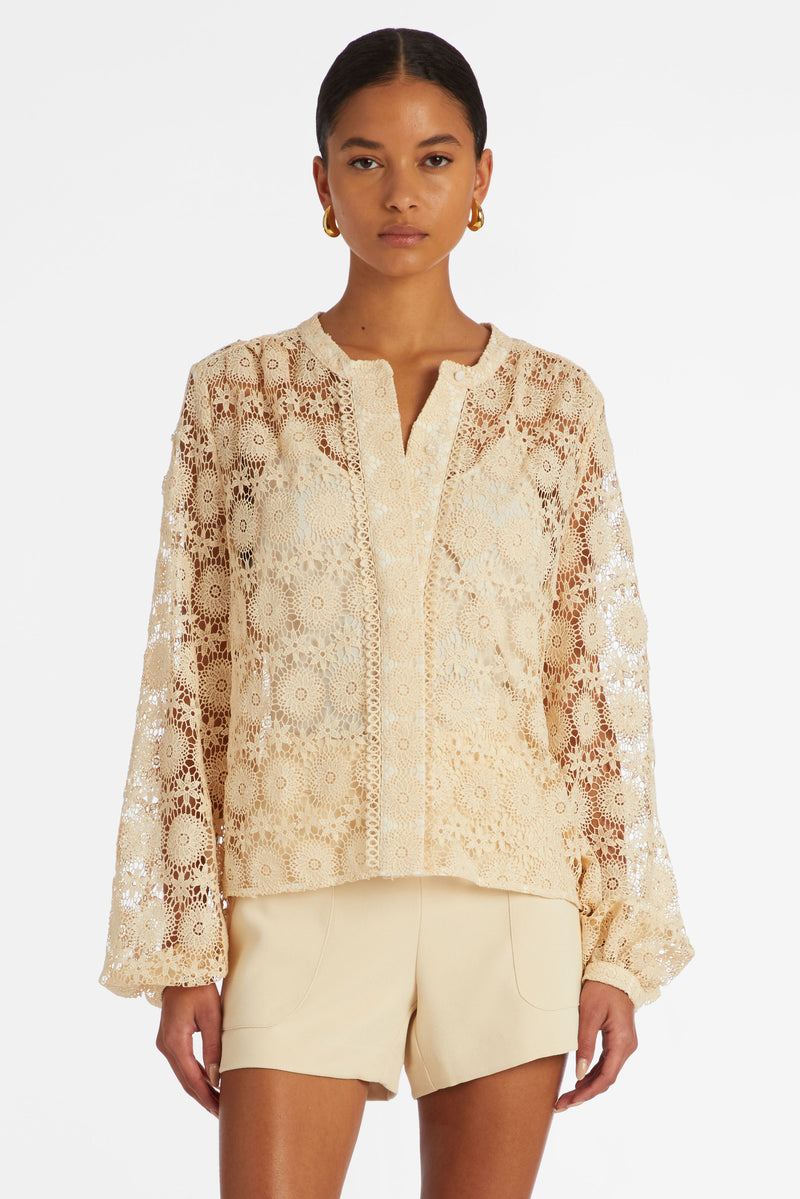 Blouse with long sleeves in a solid lace texture