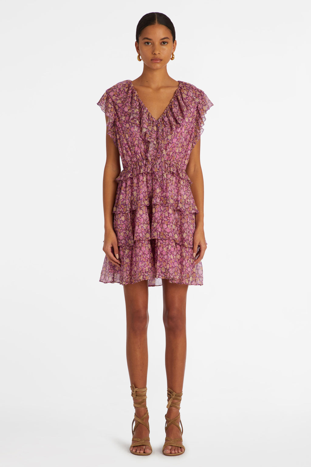Mini dress in a pink floral print that is cinched at the waist and has a tiered ruffle skirt