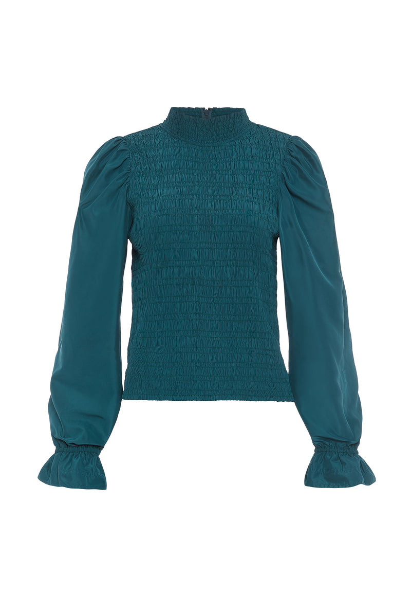 Top with a smocked bodice and long sleeves in a deep blue solid color 