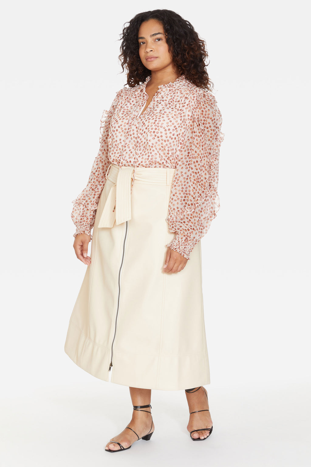 V-neck long sleeve blouse with lined bodice and sheer overlay with a sophisticated metallic pink dot pattern