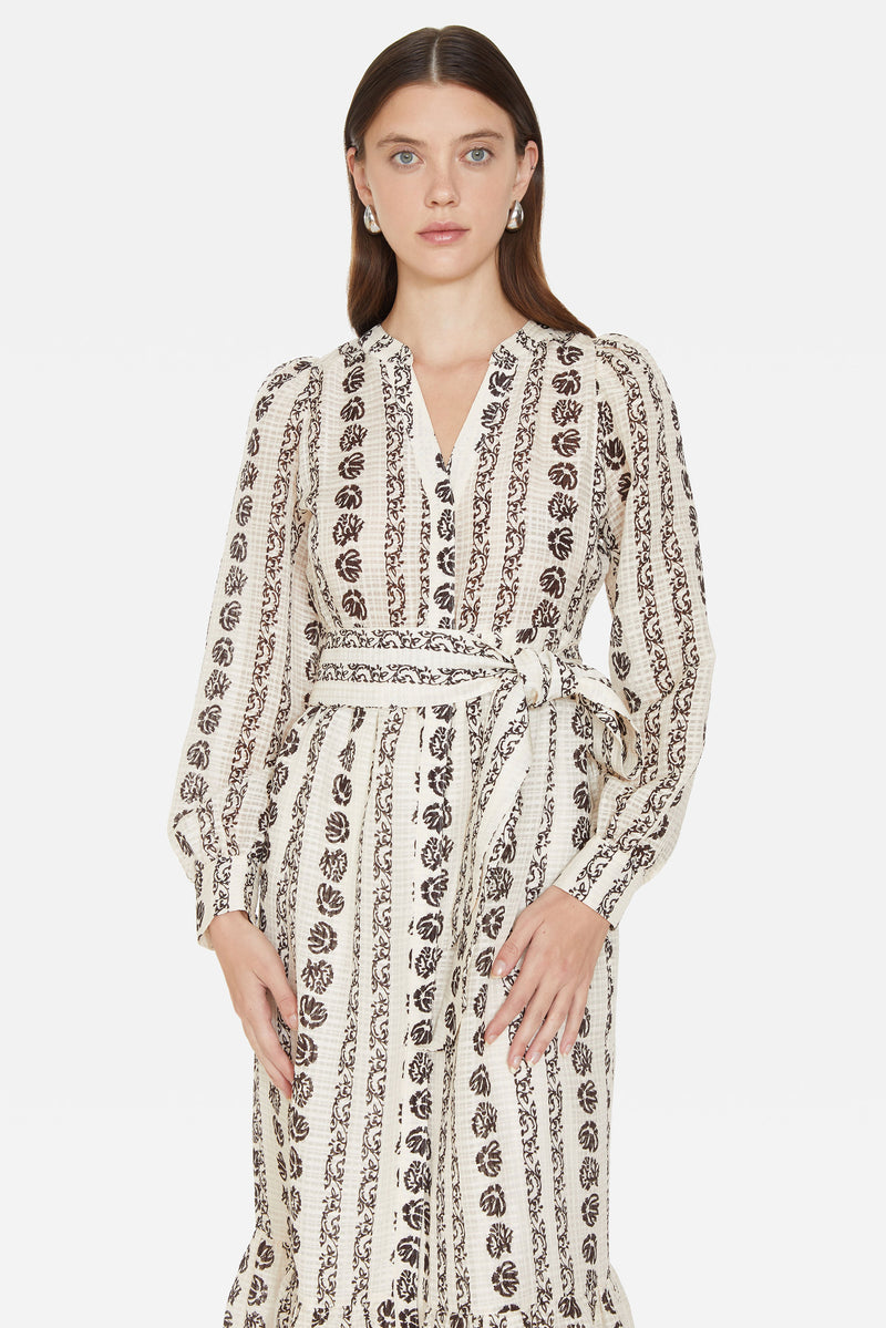 Long dress in a cream and brown floral print with buttons down the front 