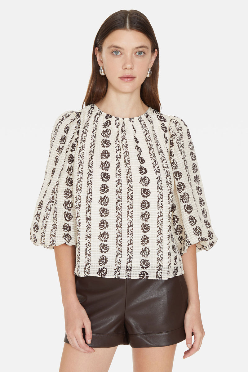 Relaxed fit top with puffed three-quarter length sleeves and gather detail at the neckline