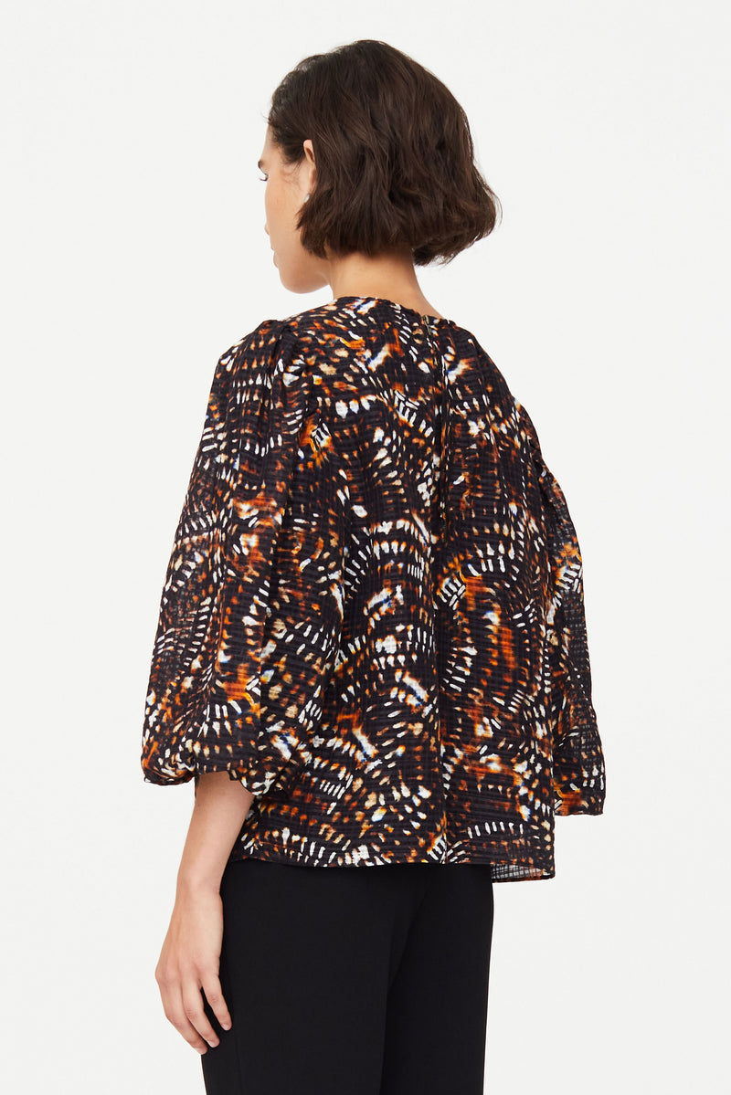 Dark patterned three quarter length loose fitting top 