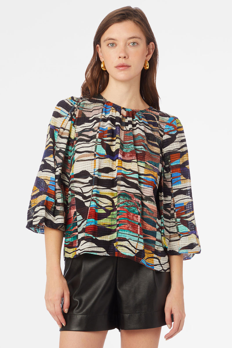 Multi-colored crewneck top with statement three-quarter length sleeve
