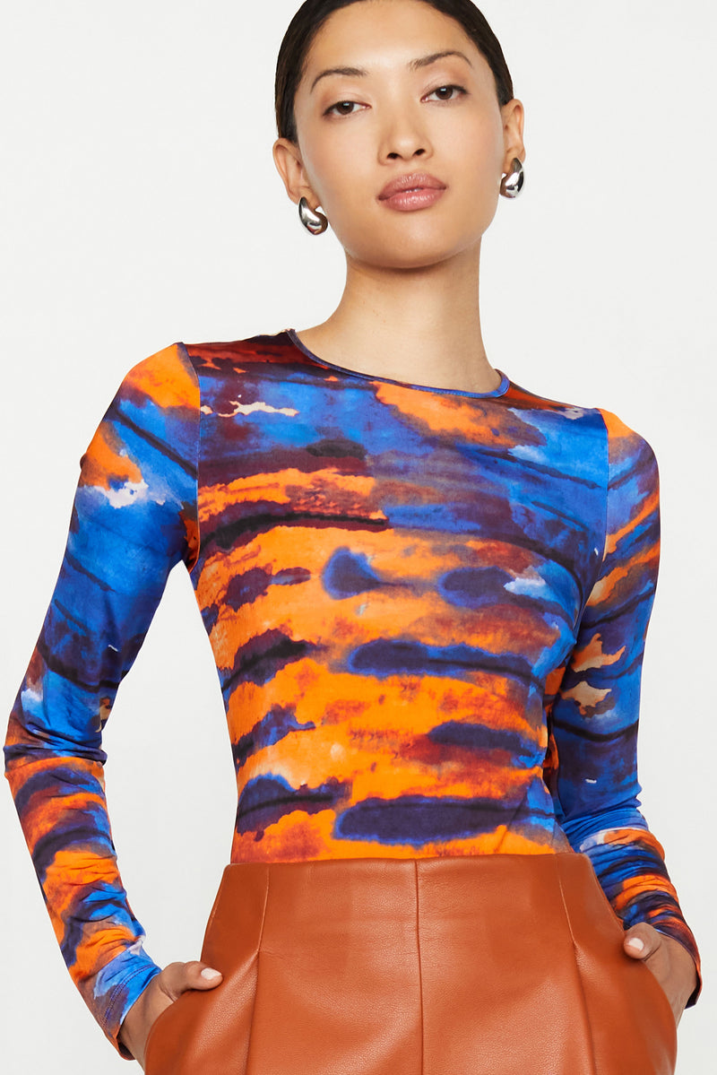 Purple and tan watercolor patterned crew neck with a form fitting cut