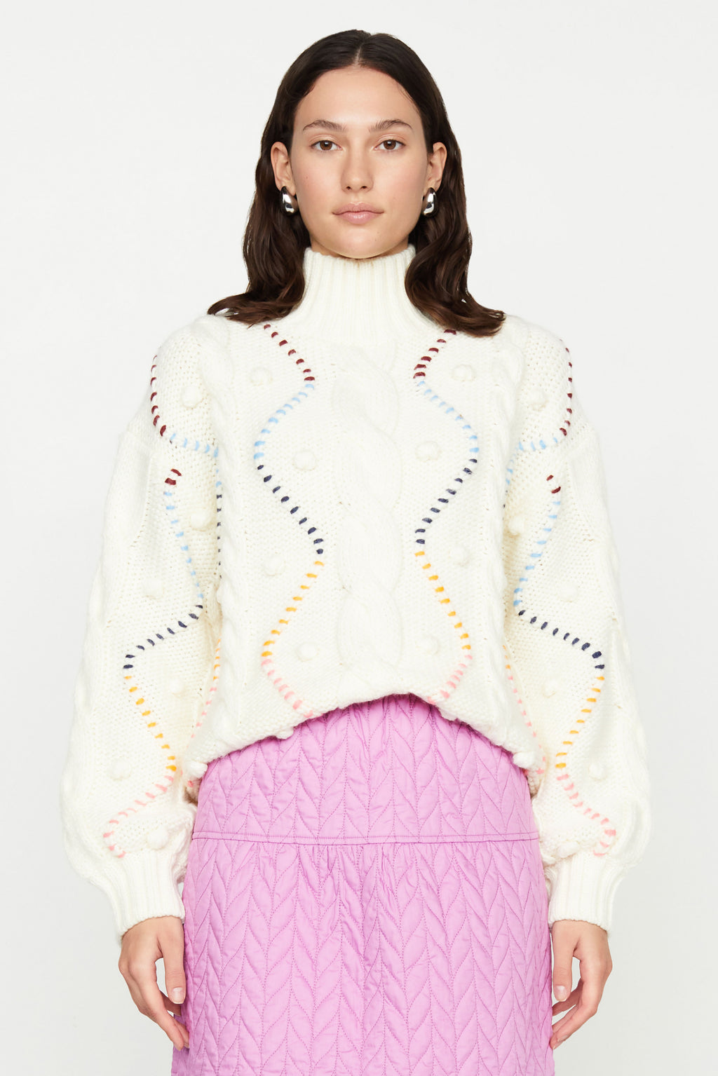 Cream sweater with colorful detailing, long sleeves and mock neckline 