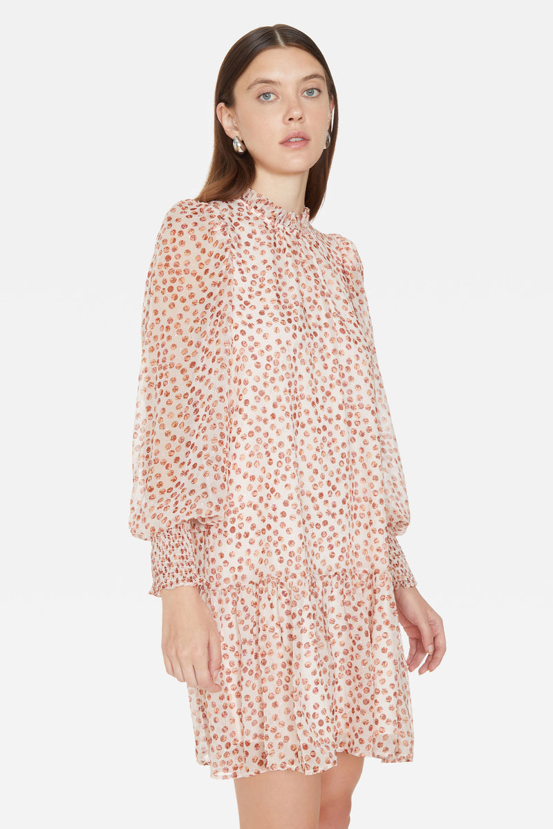 Long sleeve, a-line short dress with smocked cuff sleeves and sheer patterned overlay
