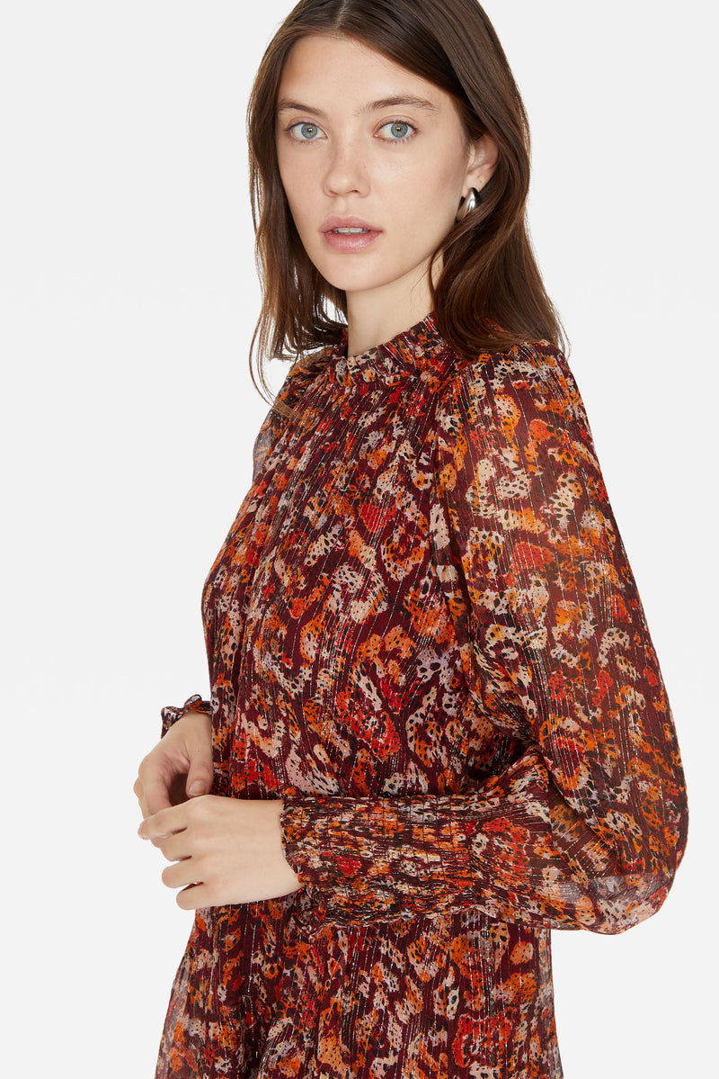 Ruffled flowy short patterned dress with long sleeves 