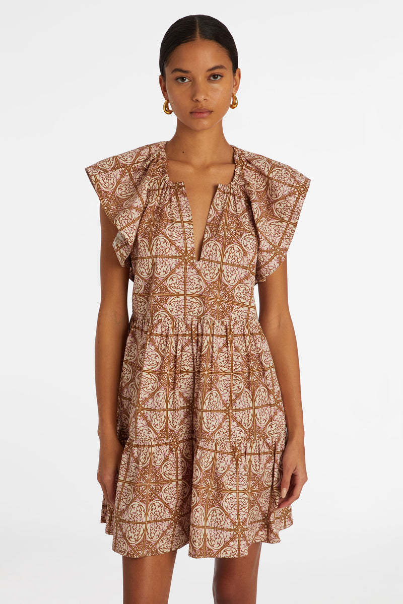 Short dress with large ruffled sleeves in a pink and brown mosaic tile print