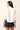 White hidden button down top