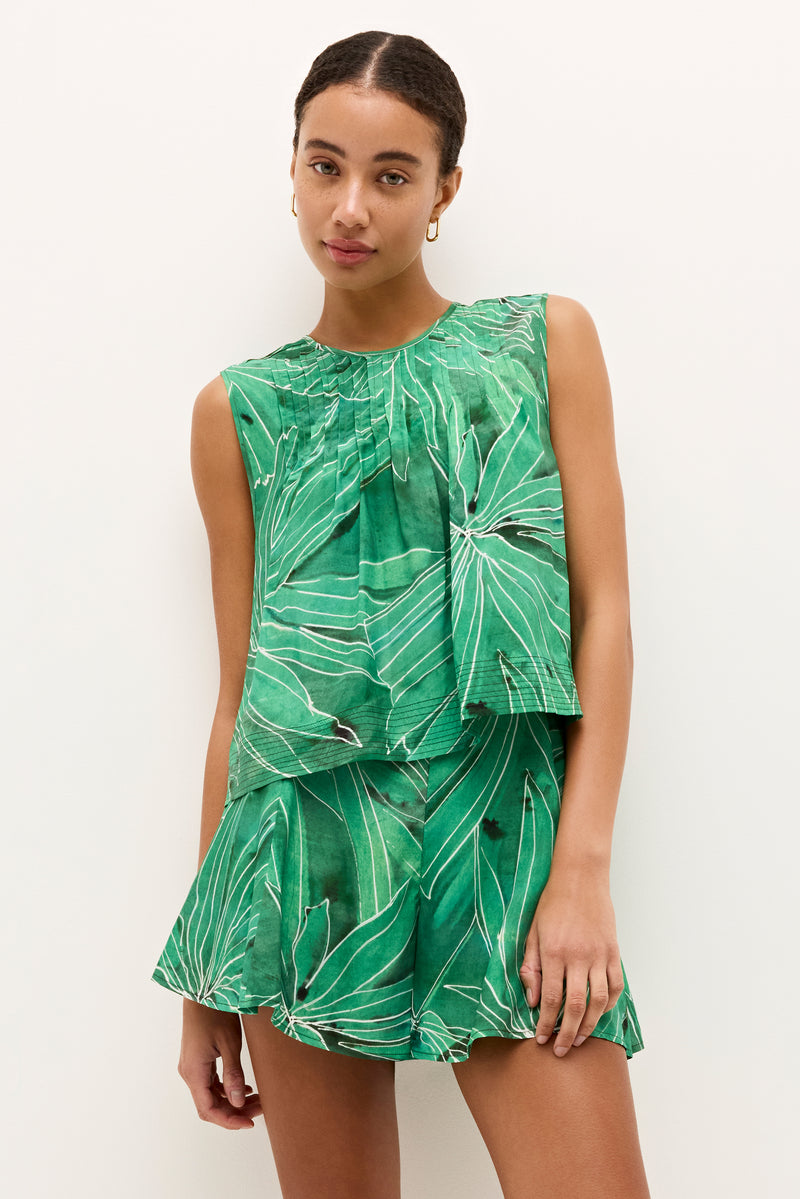 Relaxed fit shorts with abstract palm leaf design in vivid green tones
