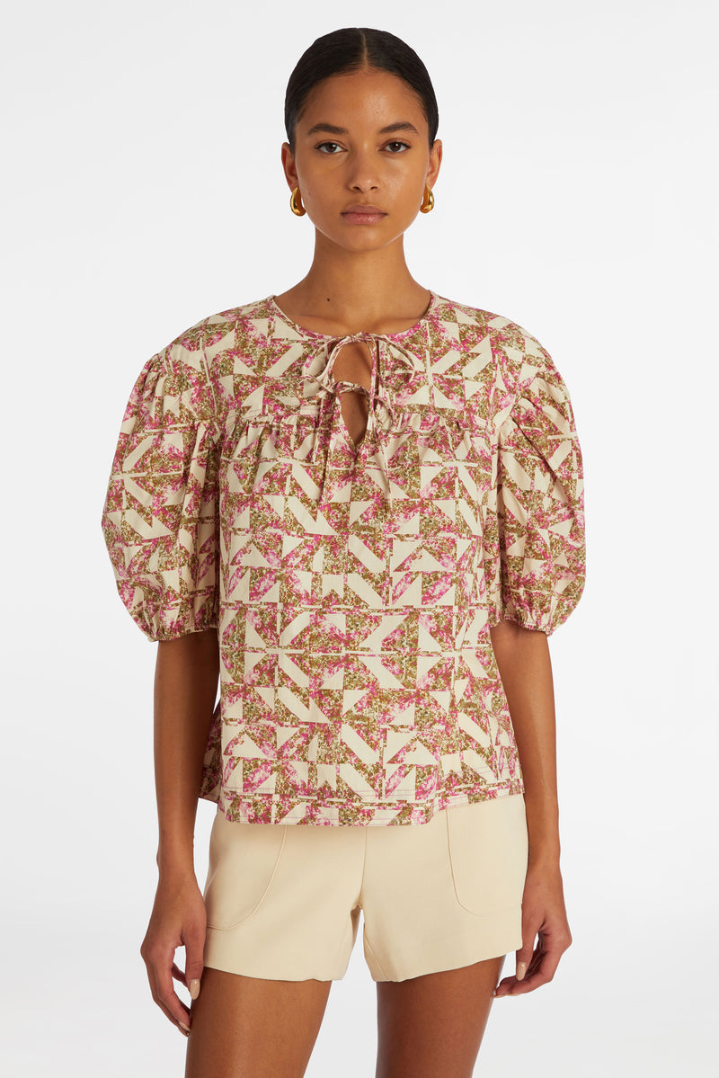 Top with short puff sleeves and adjustable v-neckline
