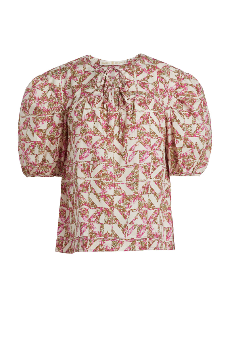 Pink and white kaleidoscope print top with short puff sleeves and a straight silhouette