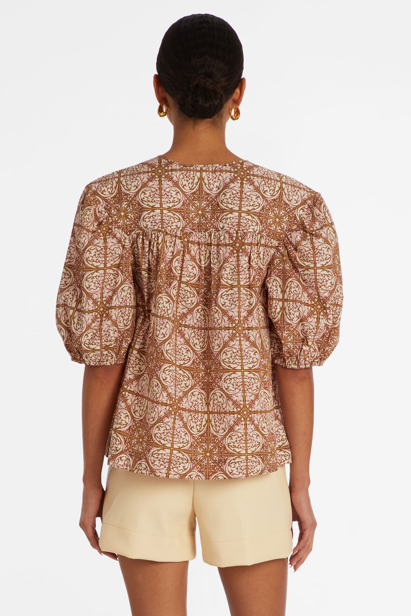 Pink and brown mosaic tile print top with short puff sleeves and a straight silhouette