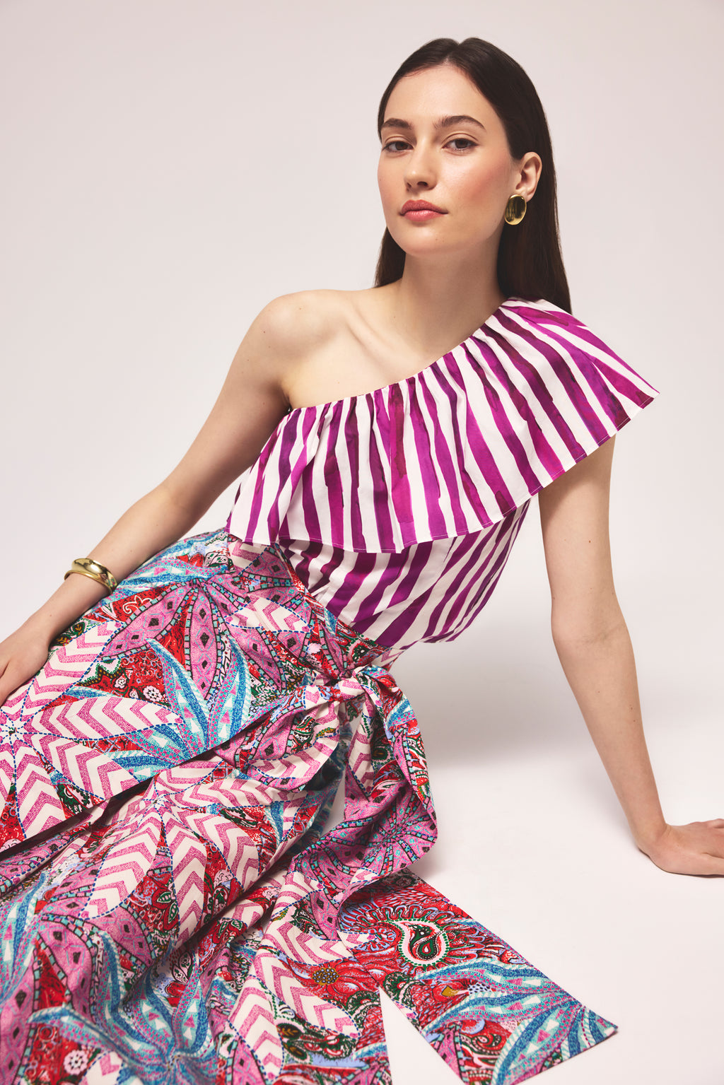 One shoulder ruffle top with vertical magenta and white stripes 