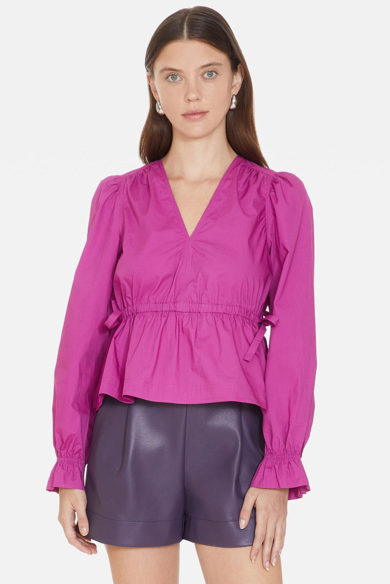Purple long sleeve v-neckline top with cinched waist and elastic cuffs