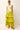 Long yellow drop waist skirt with ruffles and floral embroidered top
